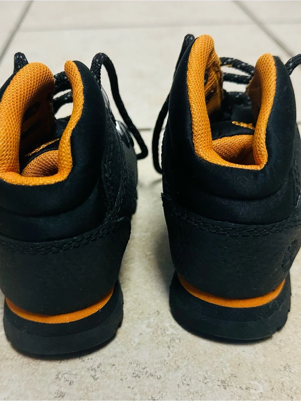 Timberland Kids Black and Orange High-Top Sneakers